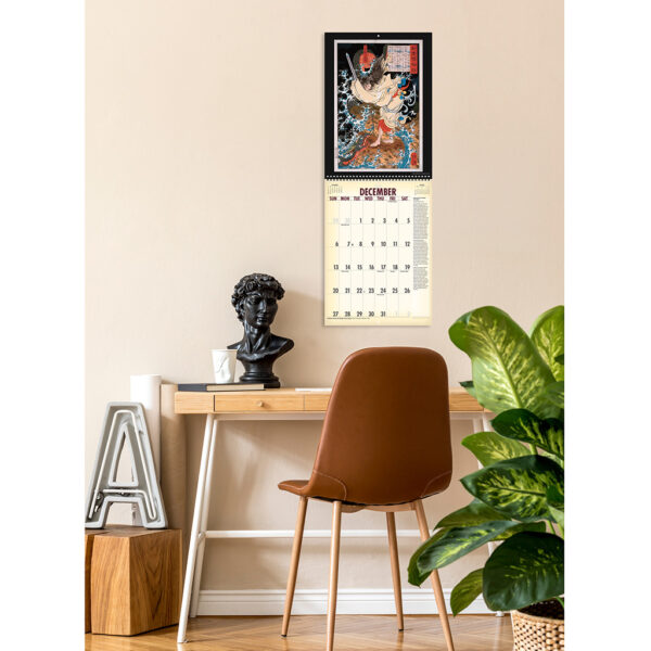 Photo showing the Asgard Press 2026 Vintage Spirits, Demons & Warriors Calendar hanging on a wall over a desk
