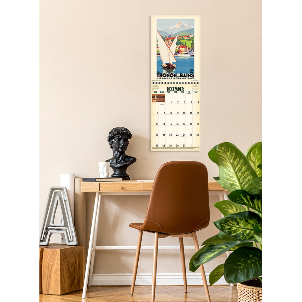 Photo showing the Asgard Press 2026 Vintage Travel Posters Calendar hanging on a wall over a desk