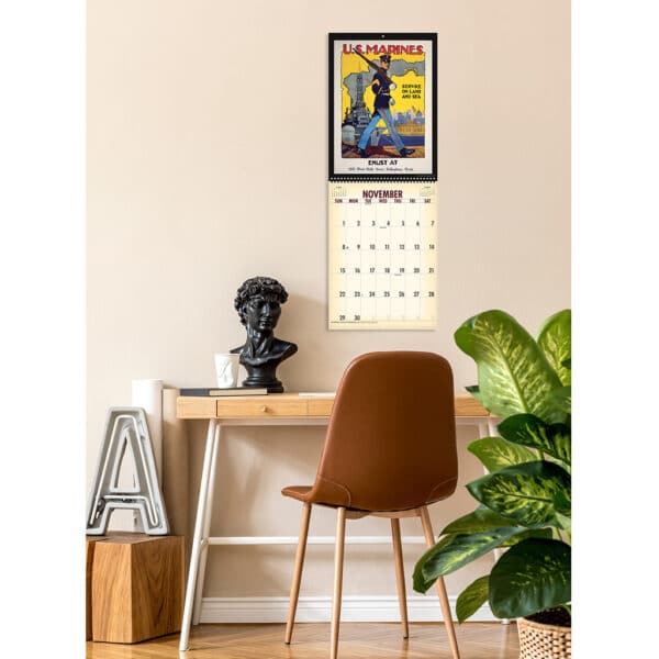 Photo showing the Asgard Press 2026 Vintage War Posters Calendar hanging on a wall over a desk