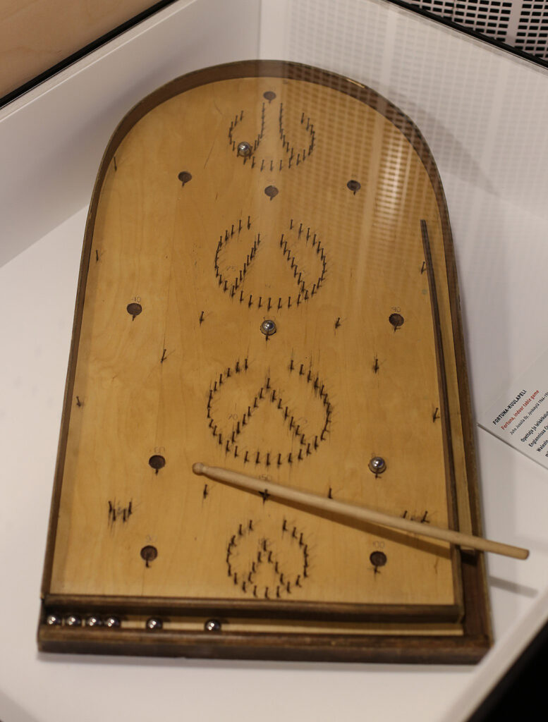 An example of a Fortuna game, an early form of pinball played on an incline using a stick to propel the balls.
