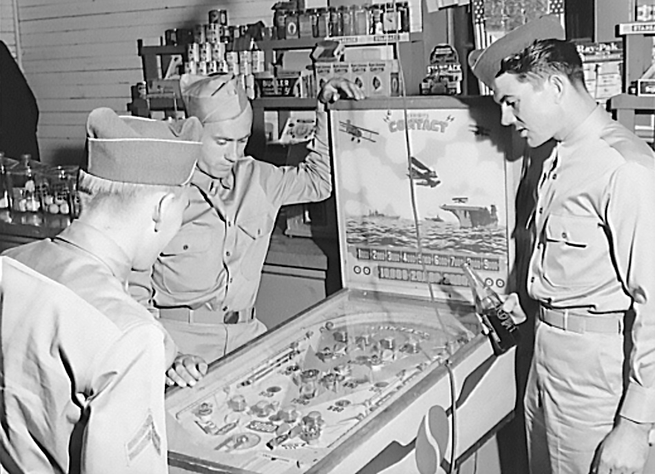 Soldiers from Fort Benning play pinball in Alabama in 1941, six years before the addition of flippers to the game.