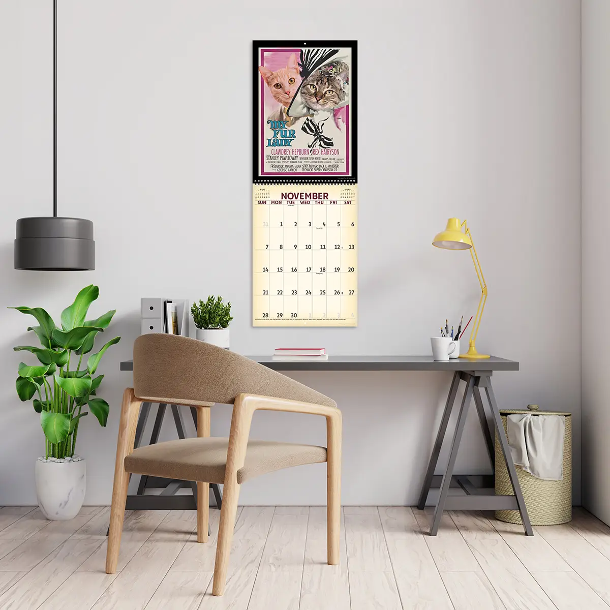 2027 Retro Film Cats Deluxe Calendar hanging above a desk