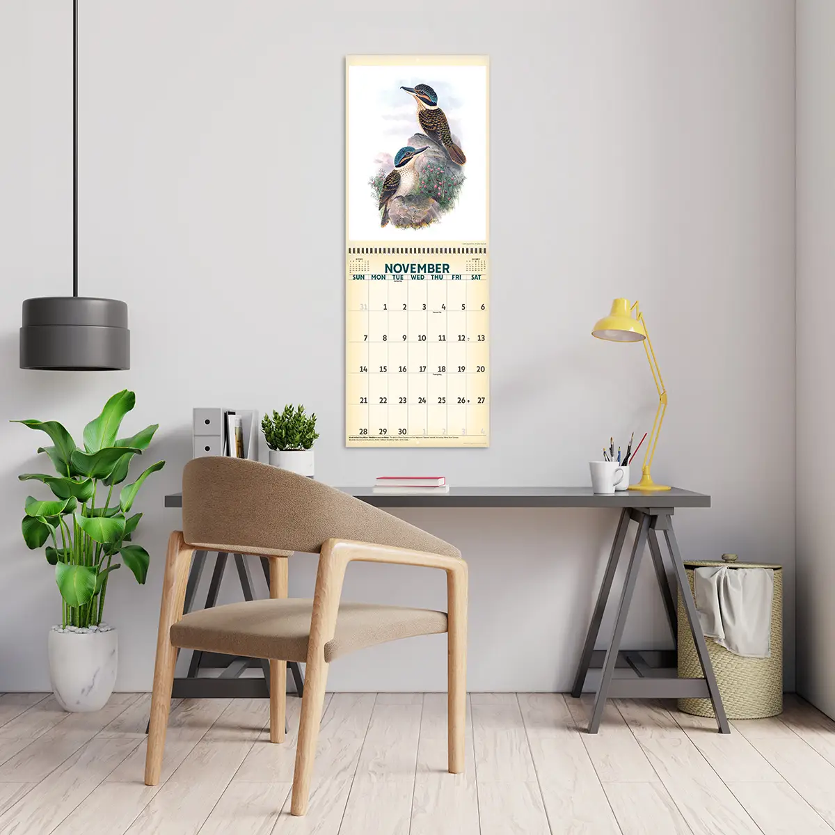 2027 Vintage Birds Deluxe Calendar hanging above a desk