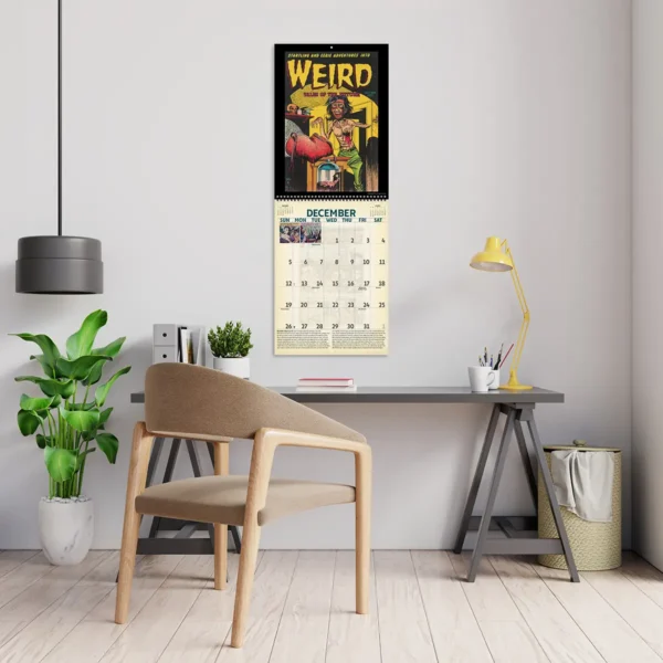 2027 Vintage Horror Comics Deluxe Calendar hanging above a desk