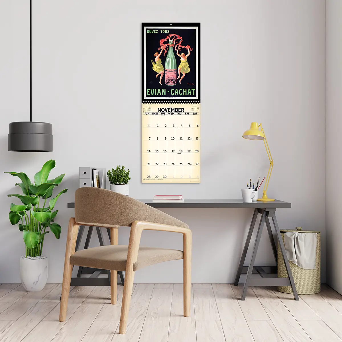 2027 Vintage Leonetto Cappiello Deluxe Calendar hanging above a desk
