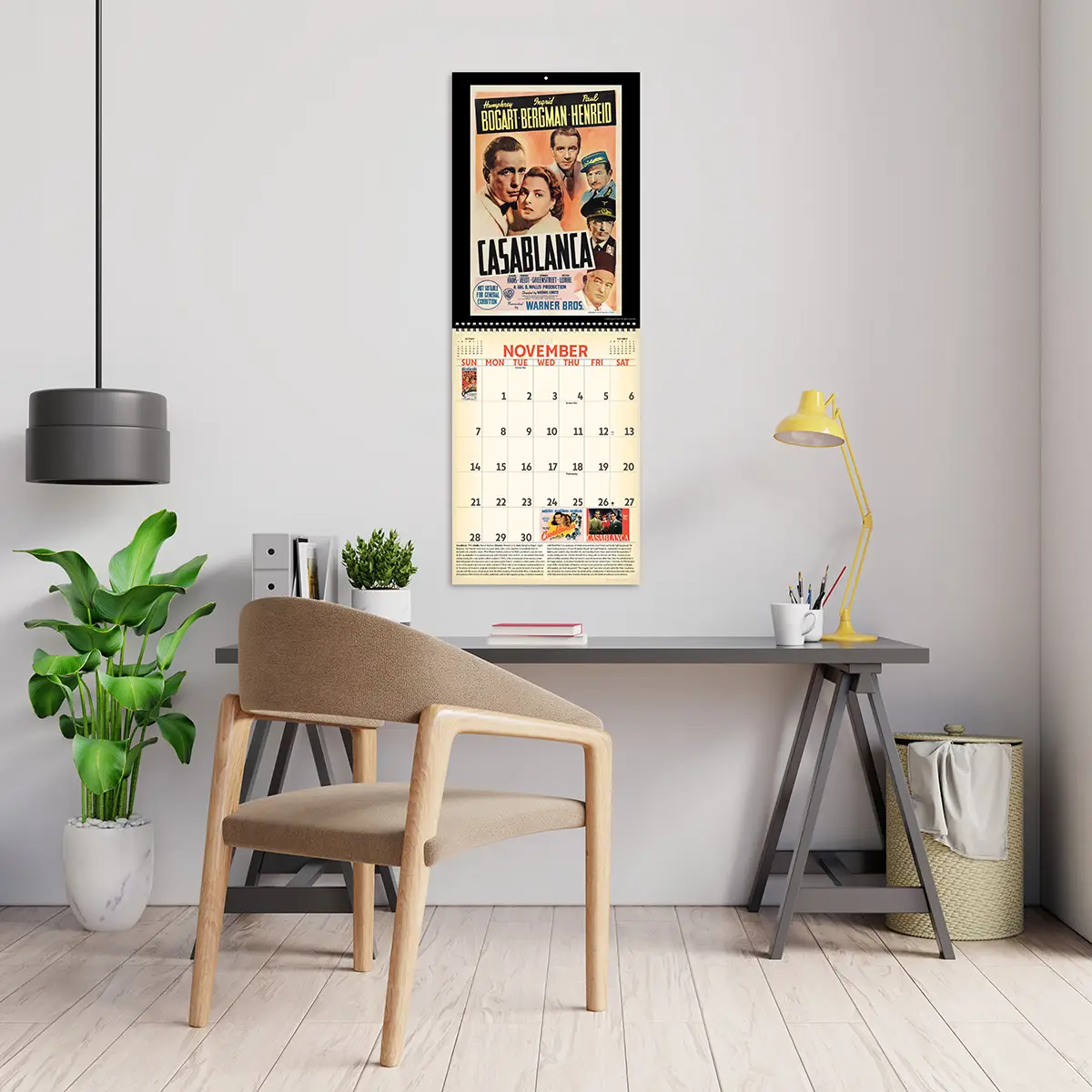 2027 Vintage Movie Posters Deluxe Calendar hanging above a desk
