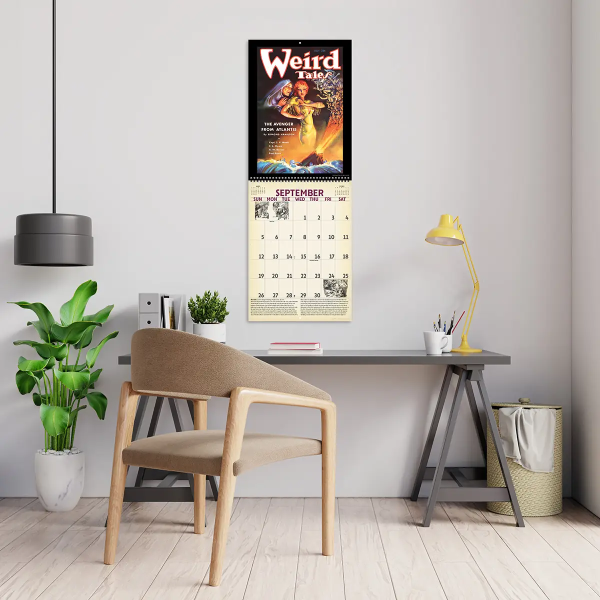 2027 Vintage Pulp Horror Deluxe Calendar hanging above a desk