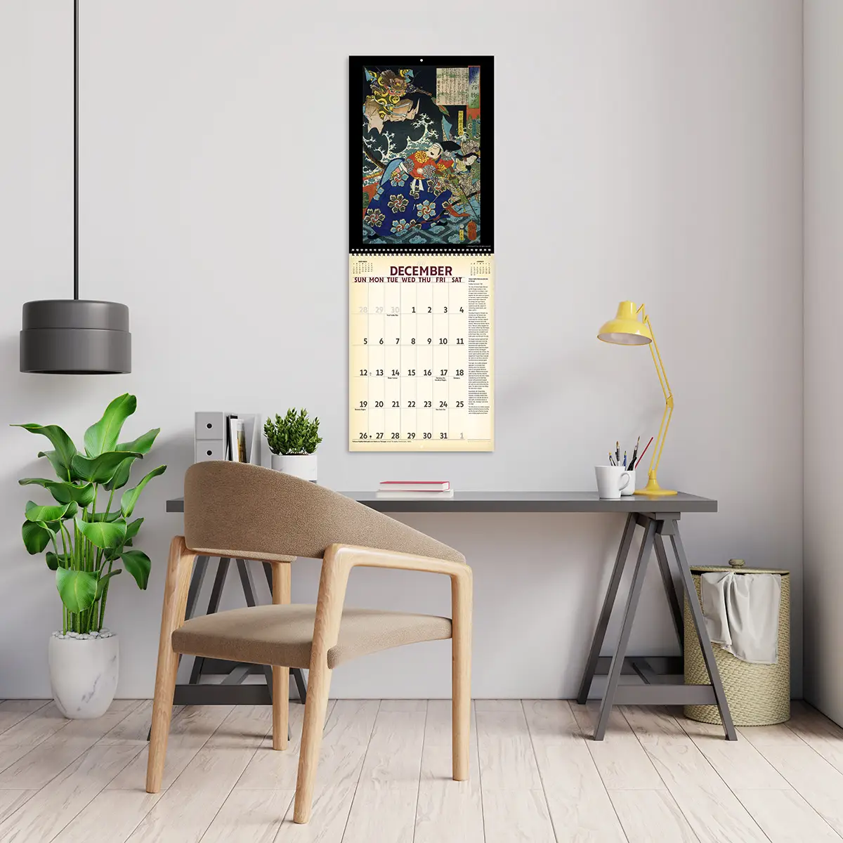 2027 Vintage Spirits, Demons, & Warriors Deluxe Calendar hanging above a desk