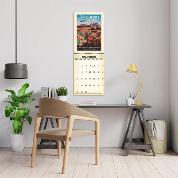 2027 Vintage Travel Posters Deluxe Calendar hanging above a desk