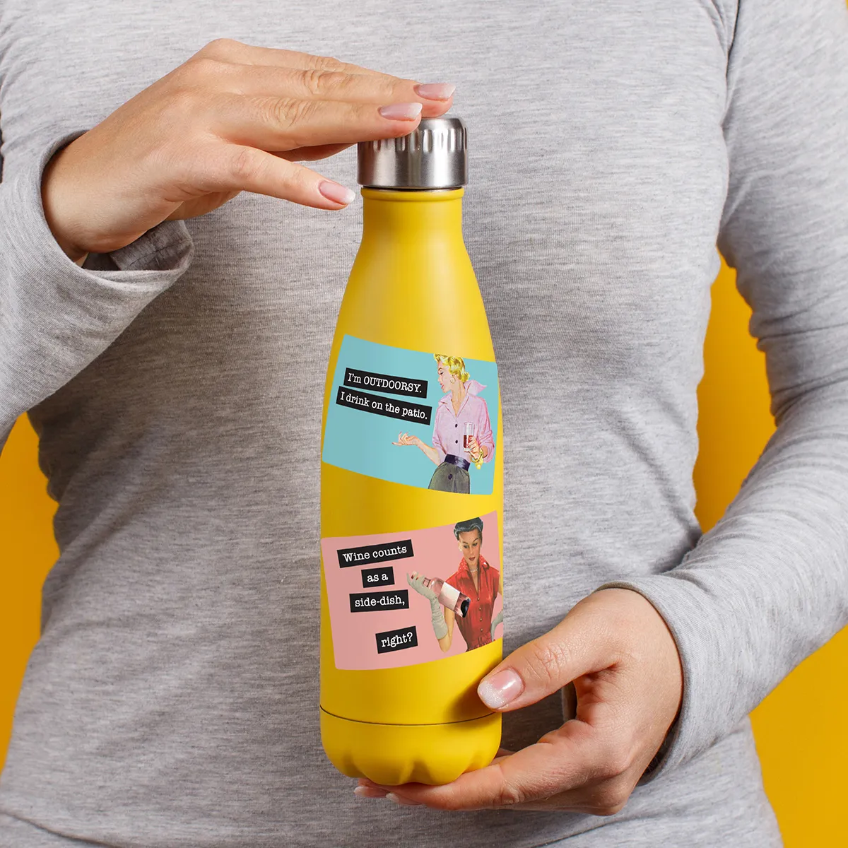 A sampling of stickers from the Retro World of Women sticker set stuck on a water bottle