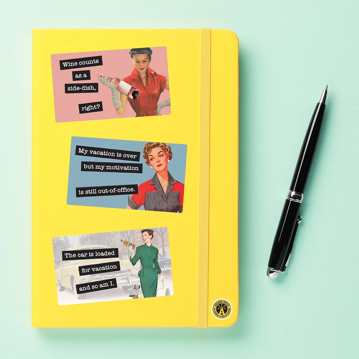 A sampling of stickers from the Retro World of Women sticker set stuck on a notebook