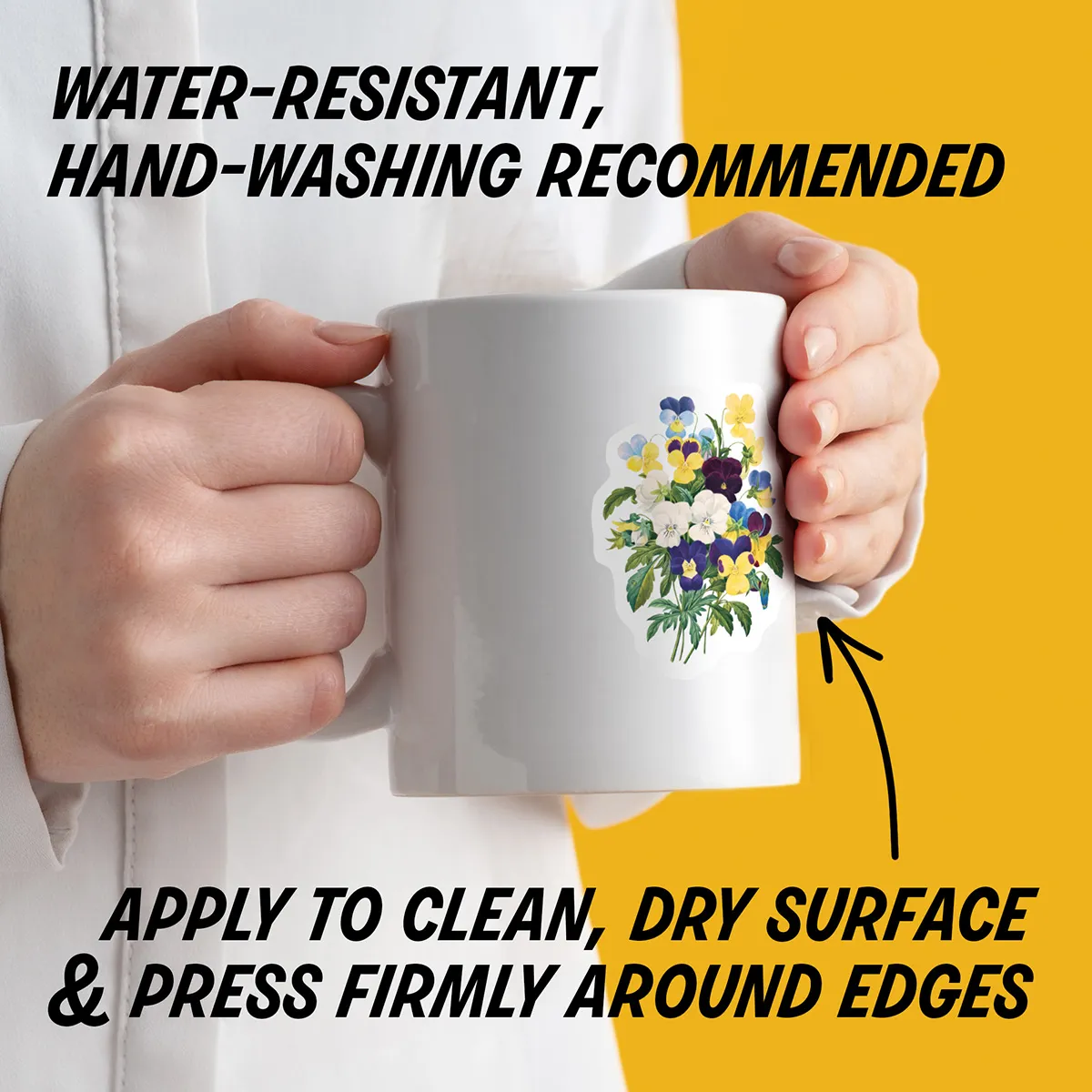 Water-resistant sticker on a mug with instructions to apply to a clean, dry surface, press edges firmly, and hand wash decorated items.