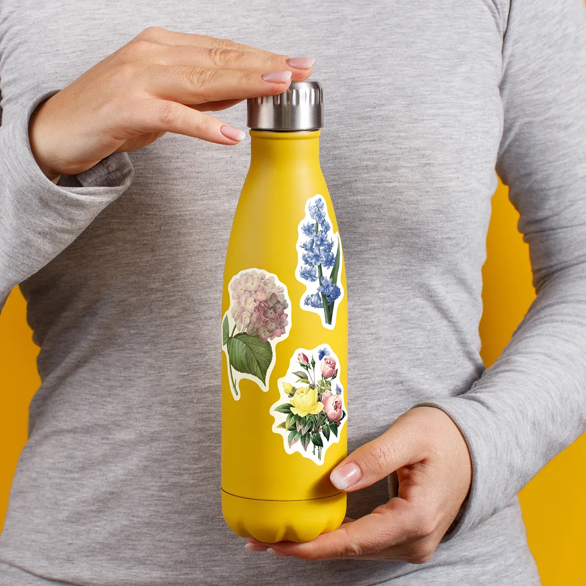 A sampling of stickers from the Vintage Botanicals sticker set stuck on a water bottle
