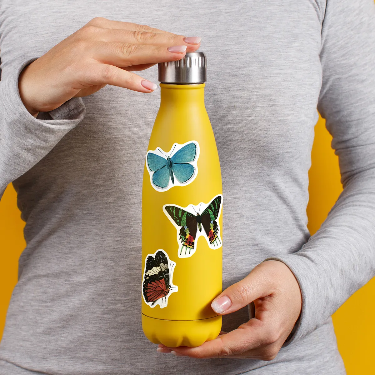 A sampling of stickers from the Vintage Butterflies sticker set stuck on a water bottle
