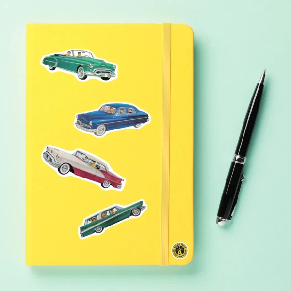 A sampling of stickers from the Vintage Cars sticker set stuck on a notebook