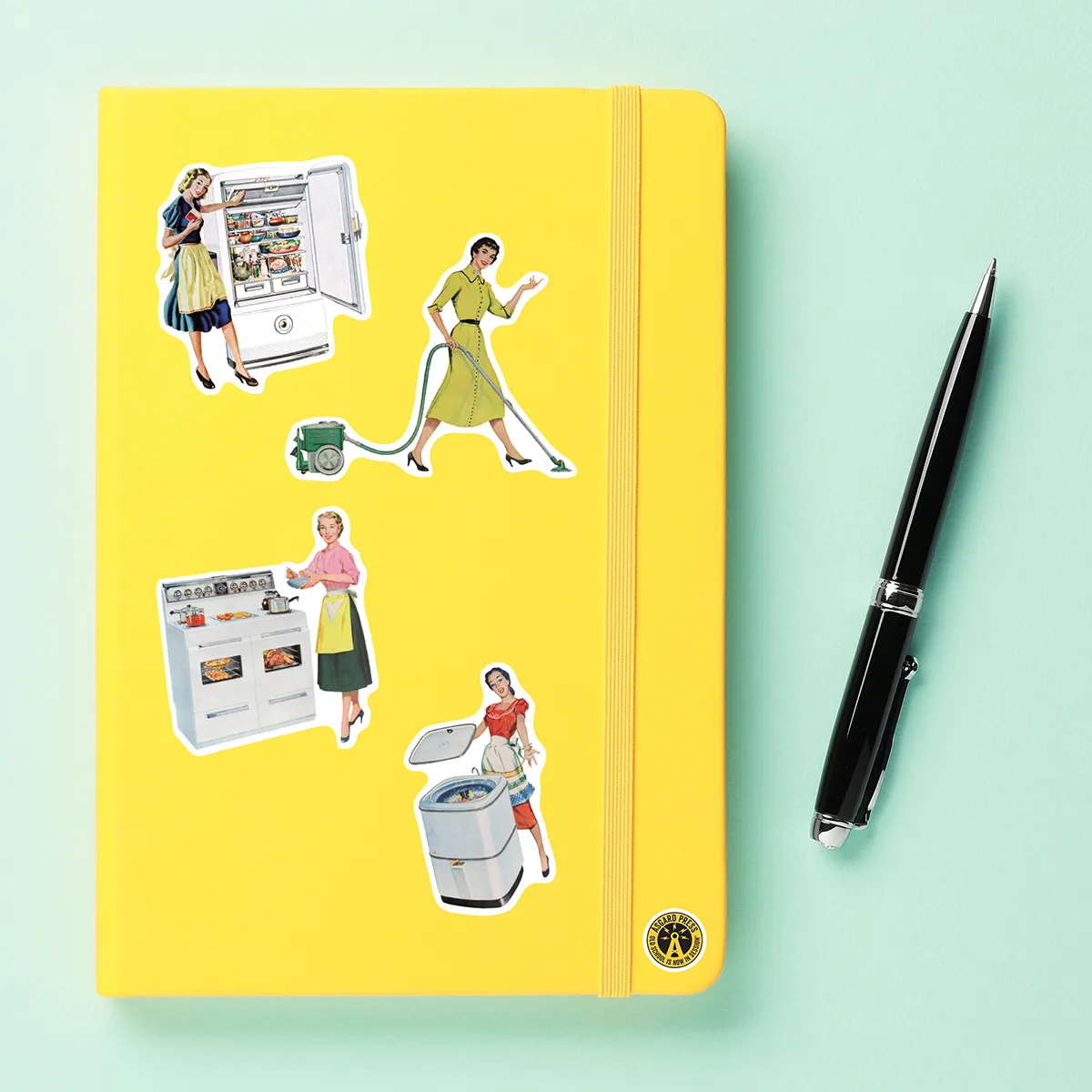 A sampling of stickers from the Vintage Domestic Bliss sticker set stuck on a notebook