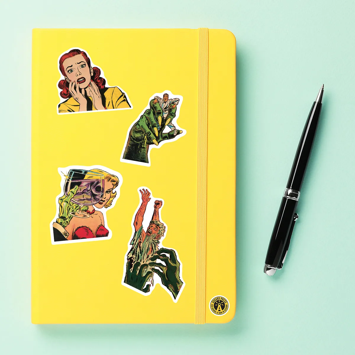A sampling of stickers from the Vintage Faces of Horror sticker set stuck on a notebook