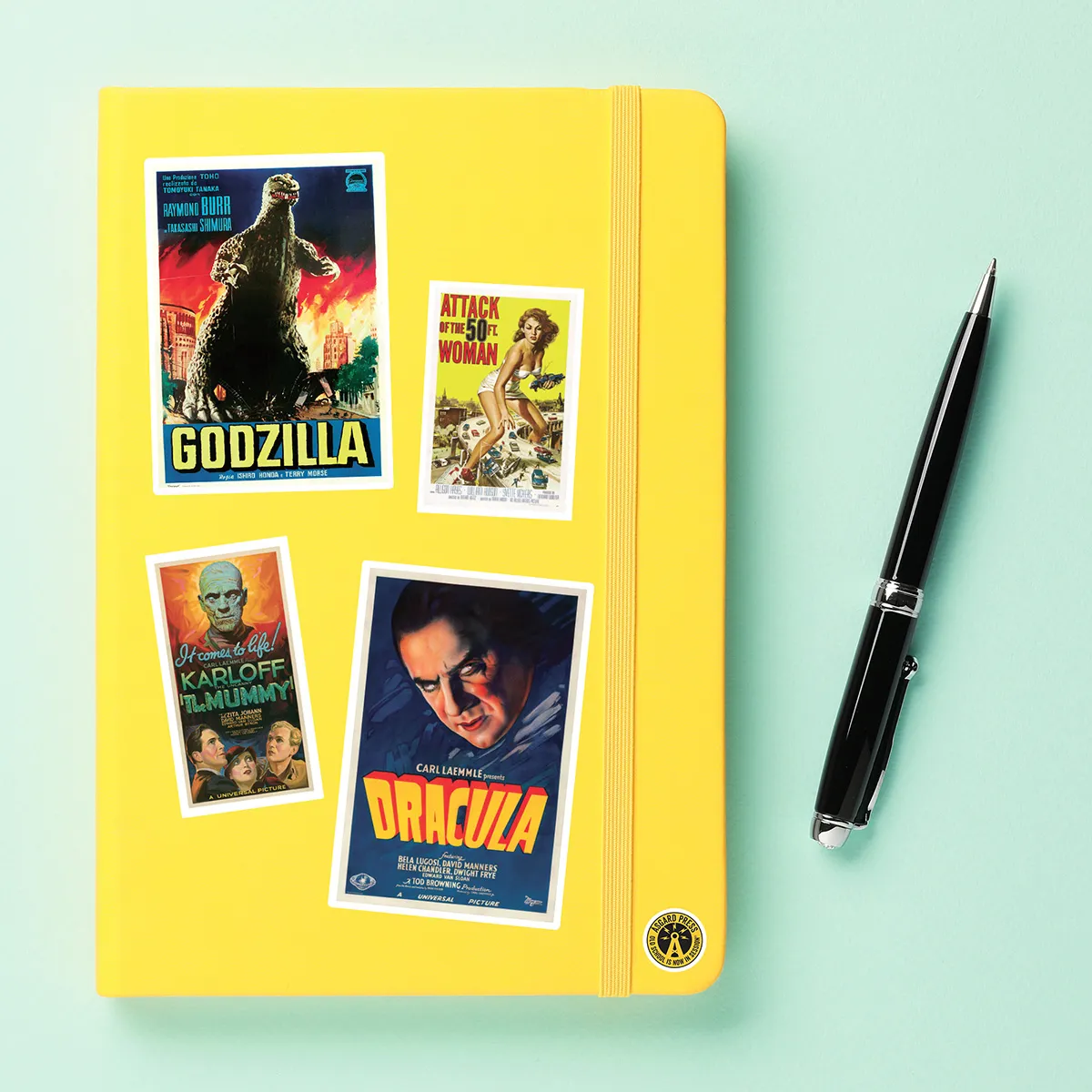 A sampling of stickers from the Vintage Horror Movies sticker set stuck on a notebook