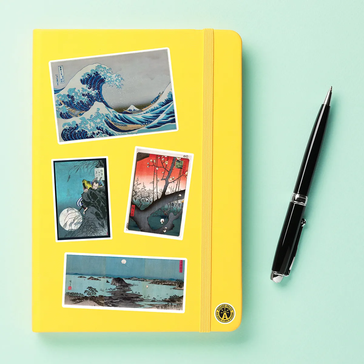 A sampling of stickers from the Vintage Japanese Prints sticker set stuck on a notebook