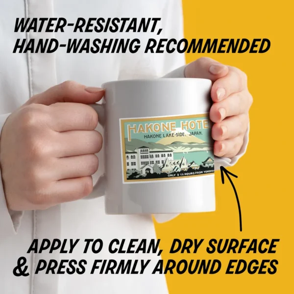 Water-resistant sticker on a mug with instructions to apply to a clean, dry surface, press edges firmly, and hand wash decorated items.