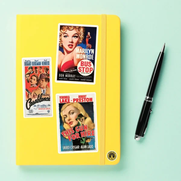 A sampling of stickers from the Vintage Movie Posters sticker set stuck on a notebook