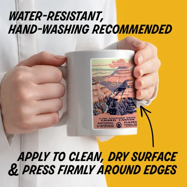 Water-resistant sticker on a mug with instructions to apply to a clean, dry surface, press edges firmly, and hand wash decorated items.