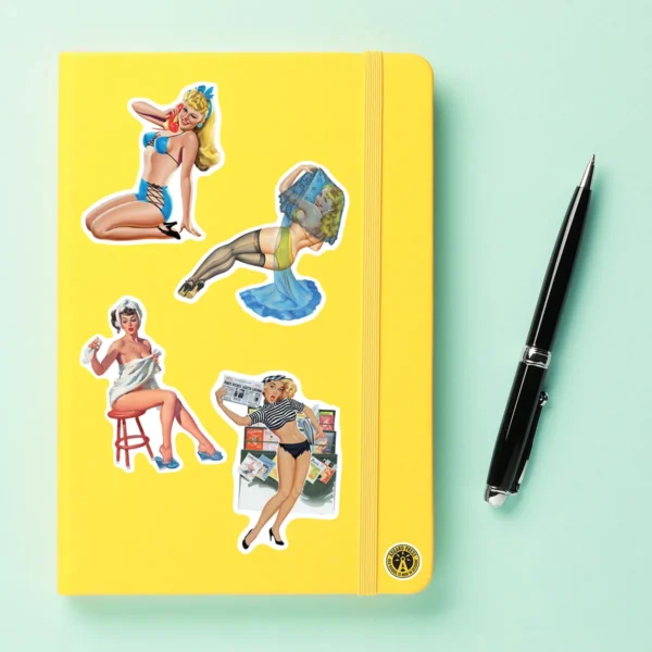 A sampling of stickers from the Vintage Pinups sticker set stuck on a notebook