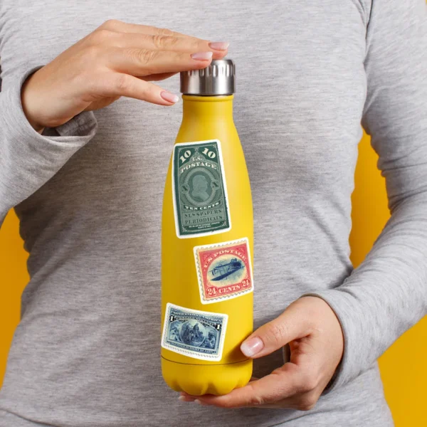 A sampling of stickers from the Vintage Postage Stamps sticker set stuck on a water bottle