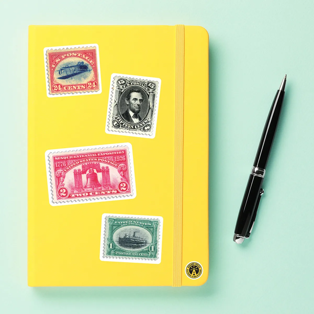 A sampling of stickers from the Vintage Postage Stamps sticker set stuck on a notebook