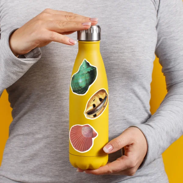 A sampling of stickers from the Vintage Sea Shells sticker set stuck on a water bottle