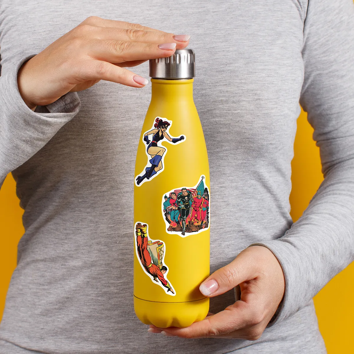 A sampling of stickers from the Vintage Superheroes sticker set stuck on a water bottle