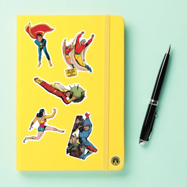 A sampling of stickers from the Vintage Superheroes sticker set stuck on a notebook