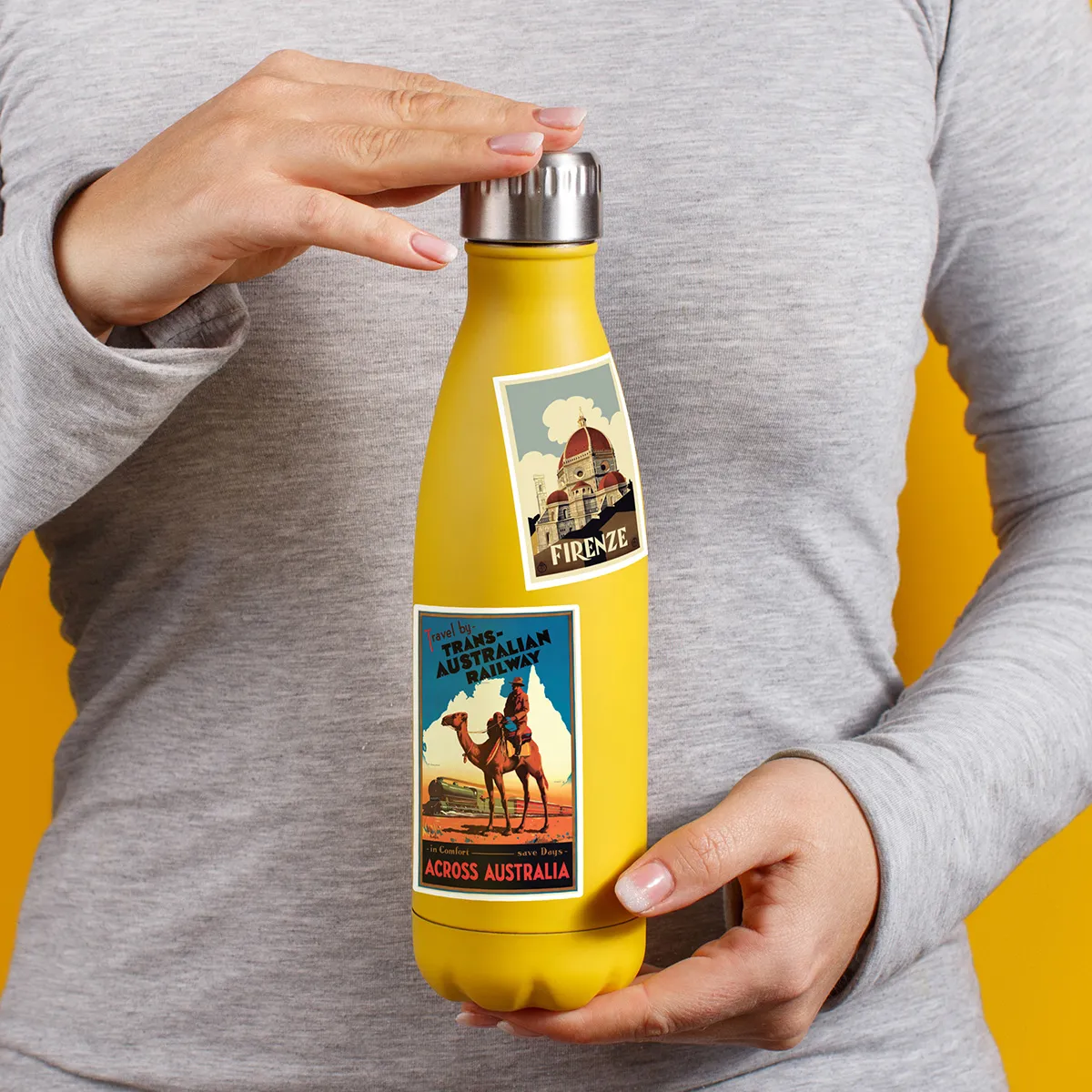A sampling of stickers from the Vintage Travel Posters sticker set stuck on a water bottle