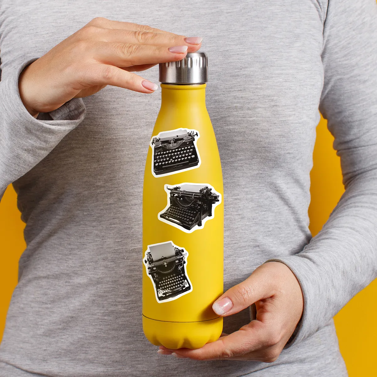A sampling of stickers from the Vintage Typewriters sticker set stuck on a water bottle