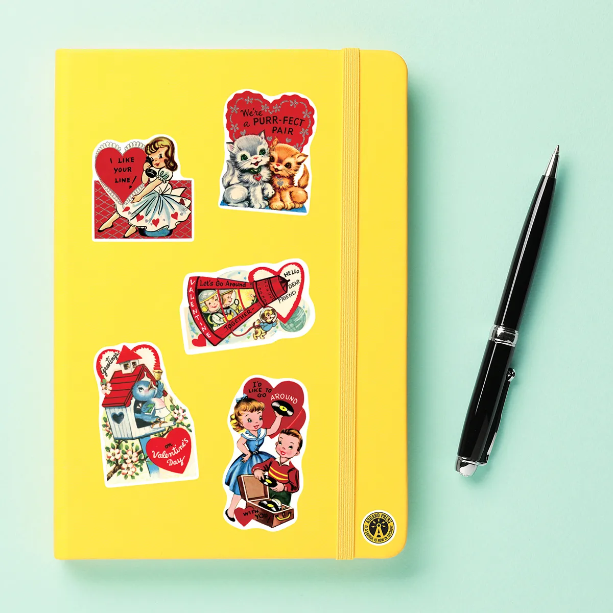 A sampling of stickers from the Vintage Valentines sticker set stuck on a notebook